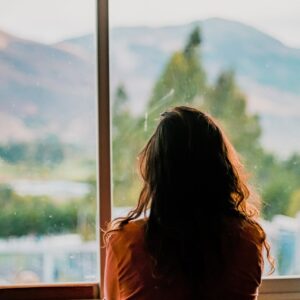 woman wearing brown shirt inside room